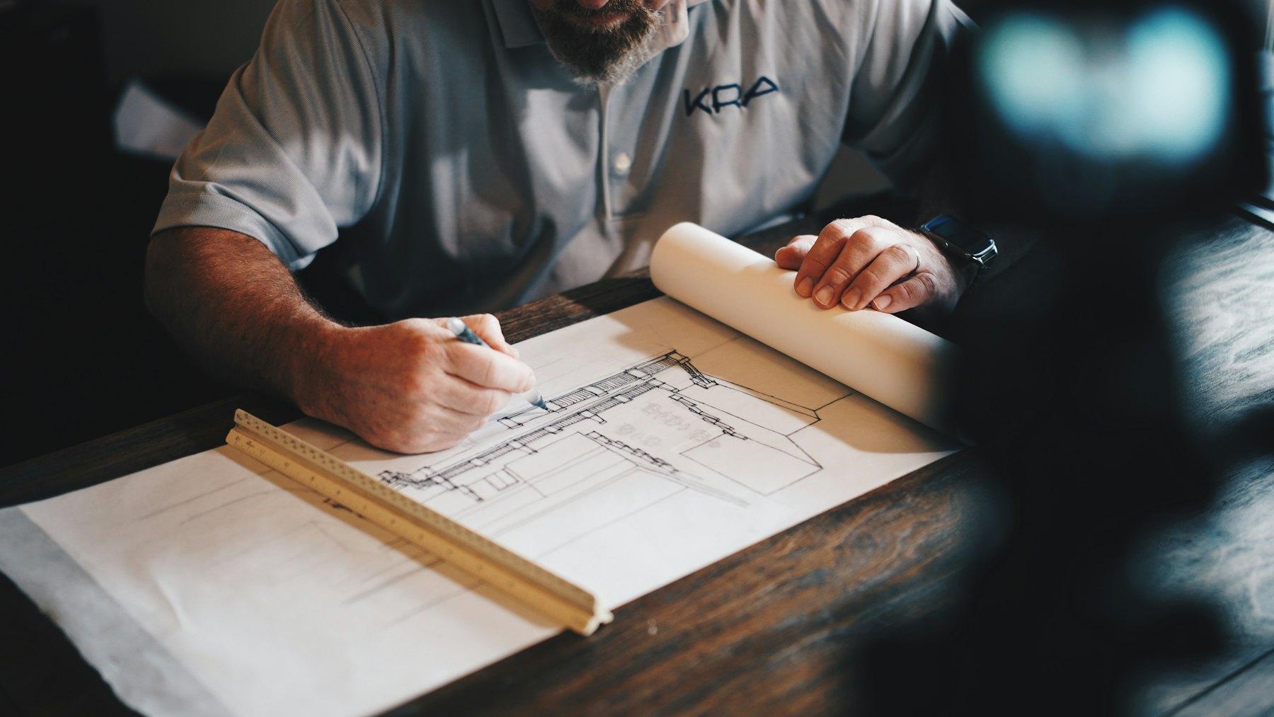 Documents and drawings being reviewed on a desk